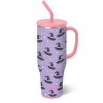 Swig Spellbound Mega Mug 40oz with glitter glow-in-the-dark bats, stars, and whimsical witch hats on a lavender background, comfort-grip handle, and silicone flexi-tip straw.
