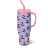 Swig Spellbound Mega Mug 40oz with glitter glow-in-the-dark bats, stars, and whimsical witch hats on a lavender background, comfort-grip handle, and silicone flexi-tip straw.
