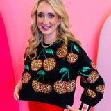 Black leopard cherry sweatshirt with sequin stem accents and relaxed cropped fit.