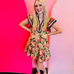 Brown floral print mini dress with flutter sleeves and tiered hem.