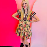 Brown floral print mini dress with flutter sleeves and tiered hem.