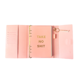 Inside view of pink magnetic closure journal folio and calendar with gold graphics.