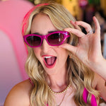 Close-up of the Sawtelle Berry Gradient Sunglasses highlighting the fuchsia-to-black gradient lenses, sharp cat eye edges, and sleek metal detailing.