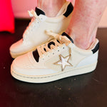 Yellow Box Cardona white and black sneakers with metallic gold star applique and cushioned insole.