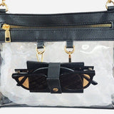 Clear crossbody bag with black trim, gold hardware, and a detachable sunglasses holder—fun, functional, and stadium-approved.