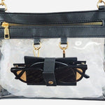 Clear crossbody bag with black trim and gold hardware, featuring a detachable sunglasses holder—fun and functional for any event.