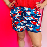 Americana camo shorts with red white and blue patriotic print.