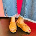 Front view of the CLEVER wedge sandal featuring a square toe and woven faux leather upper with a cork wedge base.