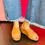 Front view of the CLEVER wedge sandal featuring a square toe and woven faux leather upper with a cork wedge base.