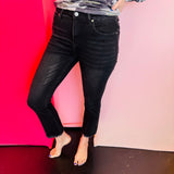 Black high-rise straight cropped jeans with raw hem and subtle distressed detailing.