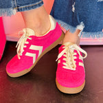 Fuchsia lace-up sneaker with suede-look upper, cream laces, and retro low-top design.