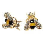 Gold bee stud earrings with yellow enamel and rhinestones.