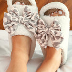 Bella leopard print cozy bow open-toe house slippers.
