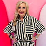 Black and ivory striped button down top with collar and contrast pocket detail.