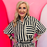 Black and ivory striped button down top with collar and contrast pocket detail.