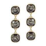 Black diamond crystal triple drop earrings with gold accents and elegant 2-inch dangle design.