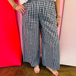 Black and white gingham wide leg pants with a smocked waistband.