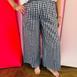 Black and white gingham wide leg pants with a smocked waistband.