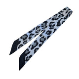 Black and grey leopard print silky scarf tie used as a twilly or purse strap.