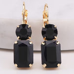 Black rectangular rhinestone dangle earrings with matching circular black rhinestone stud.