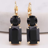 Black rectangular rhinestone dangle earrings with matching circular black rhinestone stud.