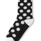 Black polka dot socks with white heel and toe accents.
