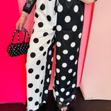 Black and white split polka dot pants with drawstring waistband and relaxed lightweight fit