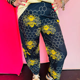 Black and yellow bee print wide leg pants with elastic waist and pockets.