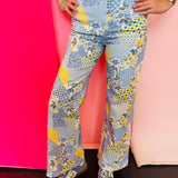 Floral patchwork wide leg denim pants with colorful mixed print design.