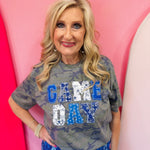 Blue Game Day tee with patchwork appliqué lettering and mixed blue print details.