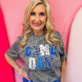 Blue Game Day tee with patchwork appliqué lettering and mixed blue print details.