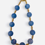 Blue marbled bead necklace with polished gold-tone accents and magnetic clasp.