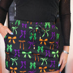 Halloween-themed skort with drawstring waist and colorful bows for a spooky look.
