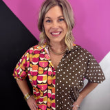 Brown mixed print cotton top with retro florals, polka dots, collar, and puff sleeves.