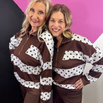 Chocolate brown quarter zip top with cream panels and brown polka dots.