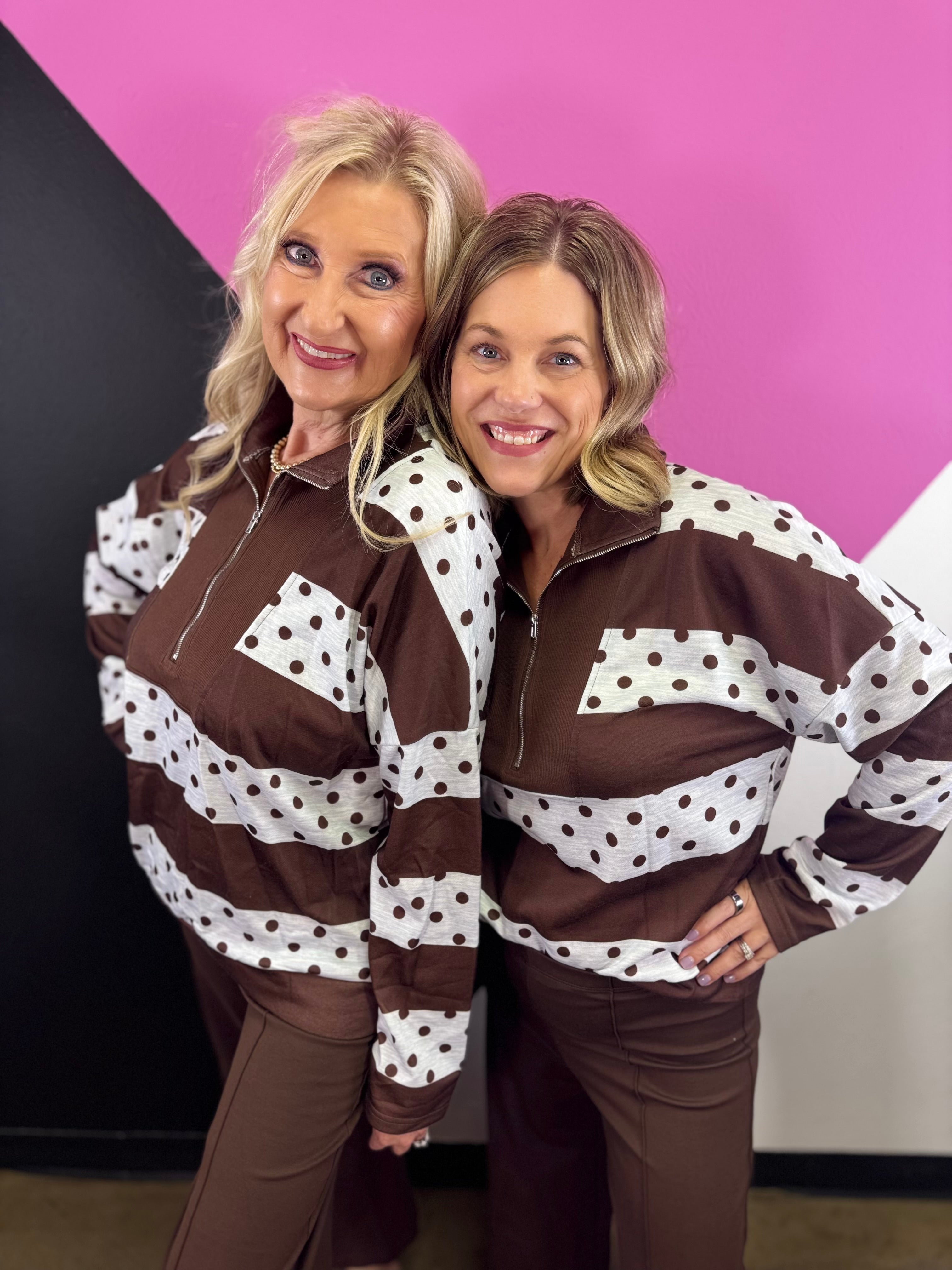 Chocolate brown quarter zip top with cream panels and brown polka dots.