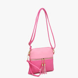 Pink crossbody bag with front zip pocket, adjustable strap, and gold hardware
