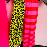 Half leopard half neon striped cropped wide-leg pants with drawstring waist and pockets.