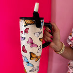 40oz butterfly print tumbler with flip straw lid and handle.