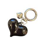 Black acrylic oversized heart charm with silver accent, perfect for scarf necklaces or trendy jewelry.