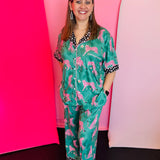 Blakeley Green luxe pajama set with pink cheetahs, stars, and polka dot trim on collar and cuffs.