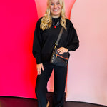 Hammitt VIP Med - A medium, black luxury leather bag with gold hardware, red zipper, shown with its convertible strap options.