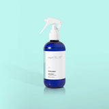 Volcano linen spray bottle with tropical citrus fragrance for refreshing fabrics.