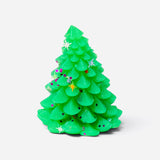 Green Christmas tree squishy with festive stars and glitter accents.