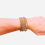 Gold bead bracelet stack set with varying sizes water resistant jewelry