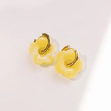 Yellow daisy earrings with removable flower charm on gold waterproof hoop