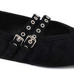 Black faux suede square toe flats with double buckle straps and silver-tone hardware.