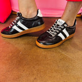 Black metallic Corky's sneakers with white side stripes and lace-up closure.