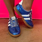 Blue metallic Corky's sneakers with white side stripes and lace-up closure.