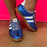 Blue metallic Corky's sneakers with white side stripes and lace-up closure.